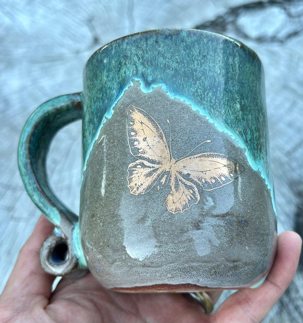 Gilded mug- Seafoam/Fawn w/ 2 Gold butterflies and curly handle 9oz
